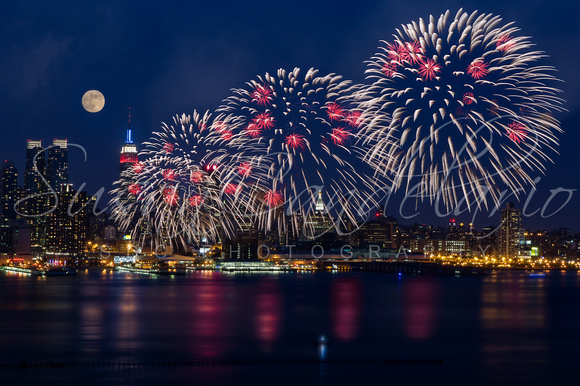 Fireworks and Full Moon Over New York City